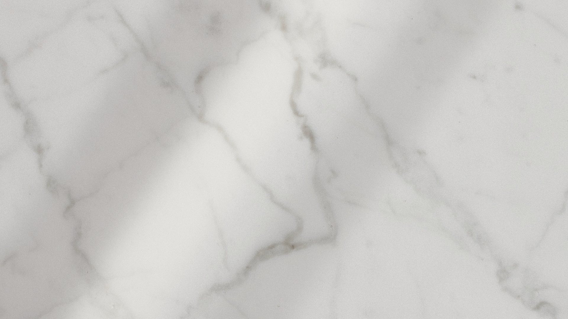 Sunlight falling across a marble wall